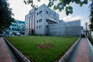The green lawn in front of the Subhasri office