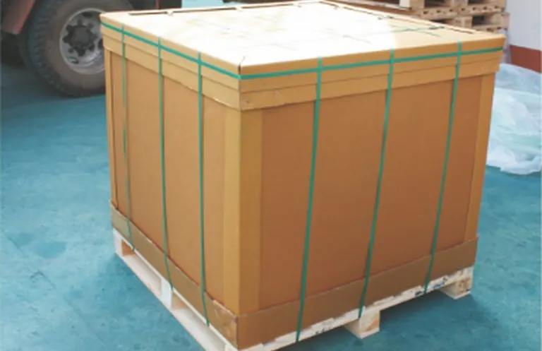 A cardboard box strapped on a wooden pallet