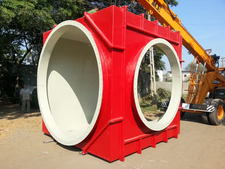 A large red FRP duct on site