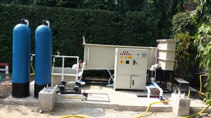 An electro-coagulation sewage treatment plant with blue filter vessels